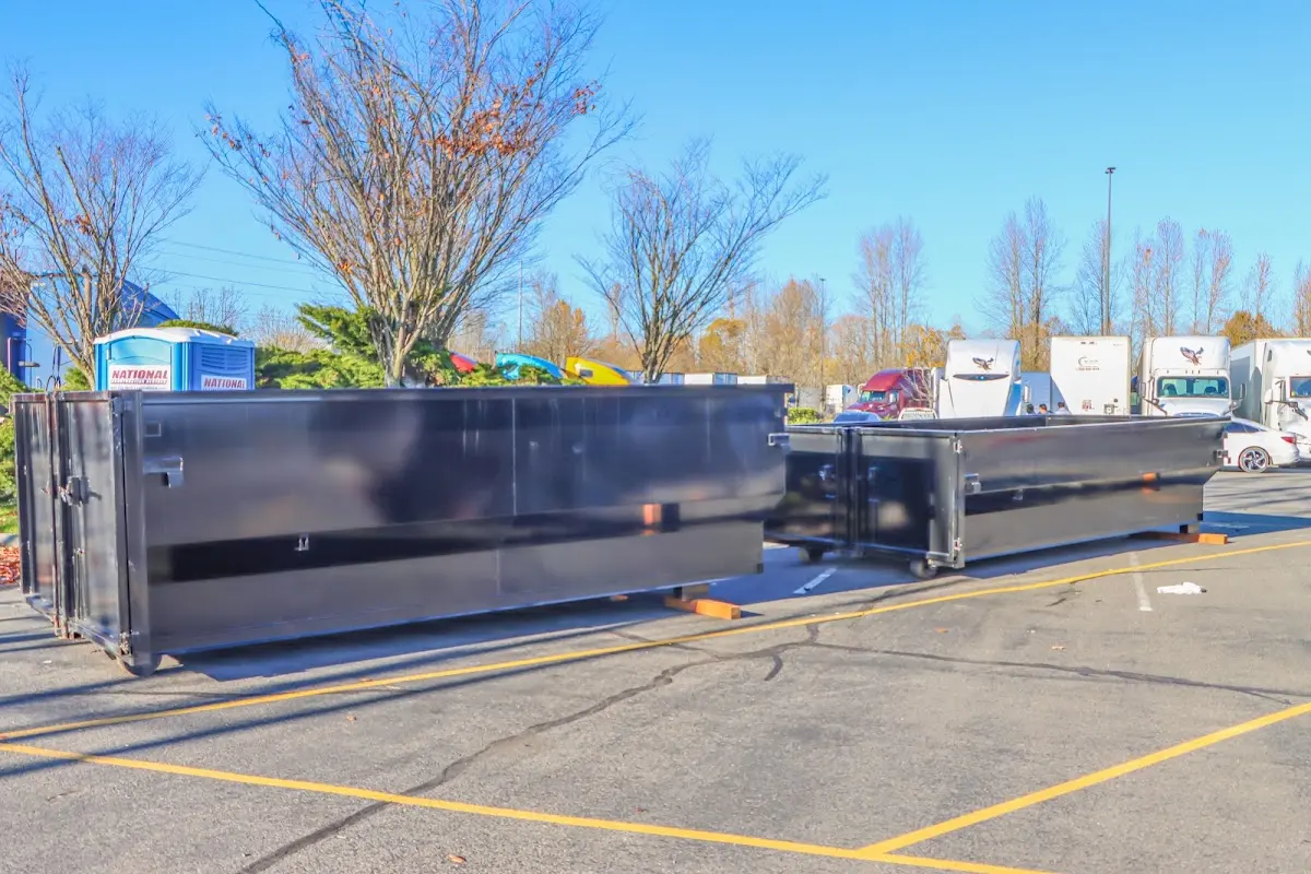 Professional dumpster rental service with roll-off container on residential driveway in Corvallis